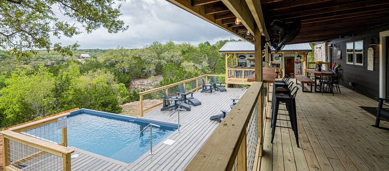 Outdoor area and pool at one of our vacation rentals in Dripping Springs, TX.